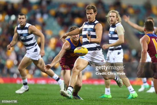 Jake Kolodjashnij of the Cats kicks during the round 16 AFL match between the Brisbane Lions and the Geelong Cats at The Gabba on July 8, 2017 in...