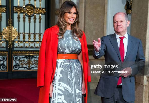 Hamburg's mayor Olaf Scholz greets US First Lady Melania Trump as she arrives to attend the partners' programme at the city hall during the G20...