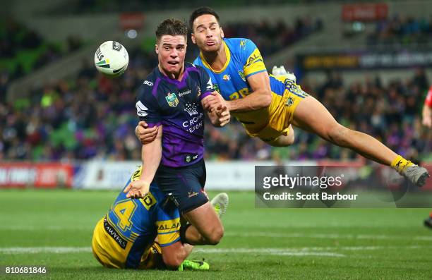 Brodie Croft of the Storm is tackled by Corey Norman of the Eels during the round 18 NRL match between the Melbourne Storm and the Parramatta Eels at...