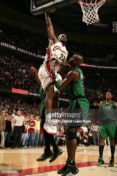 LeBron James of the Cleveland Cavaliers goes up for a dunk over Kevin Garnett of the Boston Celtics in Game Four of the Eastern Conference Semifinals...