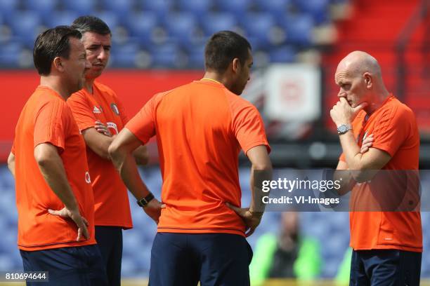 Assistant trainer Jean-Paul van Gastel of Feyenoord, assistant trainer Roy Makaay of Feyenoord, coach Giovanni van Bronckhorst, assistant trainer Jan...