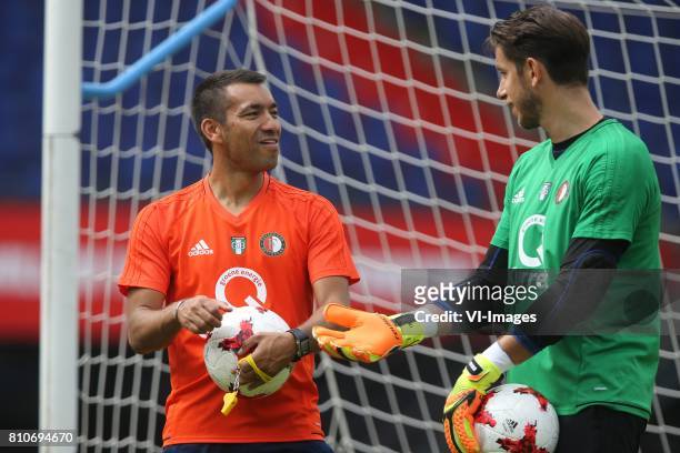 Coach Giovanni van Bronckhorst, keeper Brad Jones of Feyenoord during a training session at The Kuip on July 08, 2017 in Rotterdam, The Netherlands