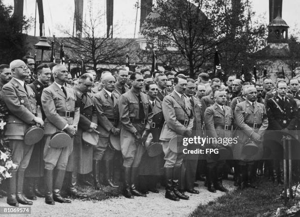 Nazi leader Adolf Hitler at the funeral of his chauffeur Julius Schreck at Grafelfing near Munich, 20th May 1936. Schreck was a Nazi party member and...