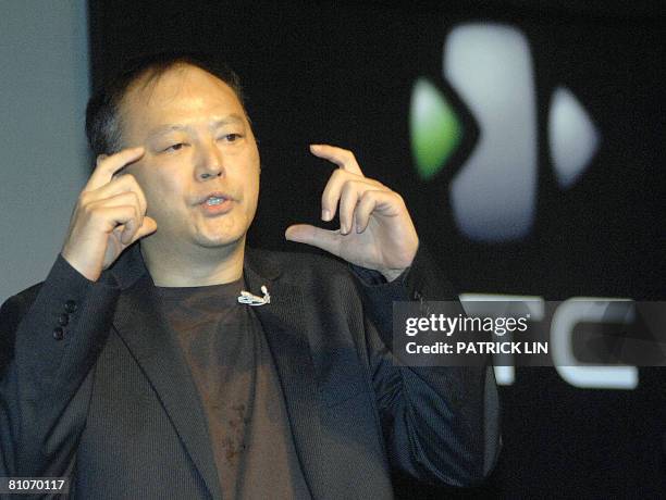 Peter Chou, president and chief executive officer of Taiwan's High Tech Computer Corp. , gestures while unveiling its new flagship phone during a...