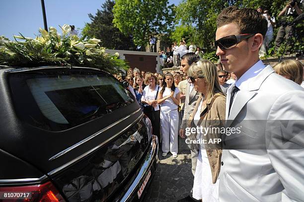 Mother and brother of Belgian football player Francois Sterchele attend his funeral ceremony on May 13, 2008 in the Saint-Remy church in Alleur, near...