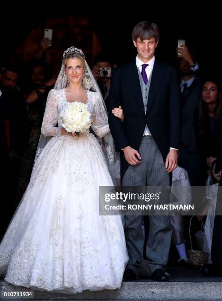 Ekaterina of Hanover and Prince Ernst August of Hanover leave after their church wedding ceremony in Hanover, central Germany, on July 8, 2017. -...