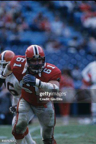 Center John Scully of the Atlanta Falcons runs upfield to block against the Cleveland Browns in Atlanta Fulton-County Stadium on November 18, 1984 in...