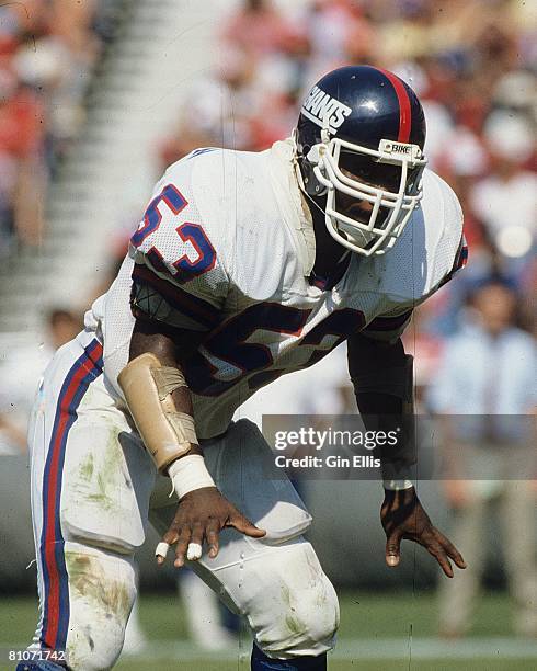 Linebacker Harry Carson of the New York Giants runs in pursuit against the Atlanta Falcons in Atlanta Fulton-County Stadium on October 14, 1984 in...