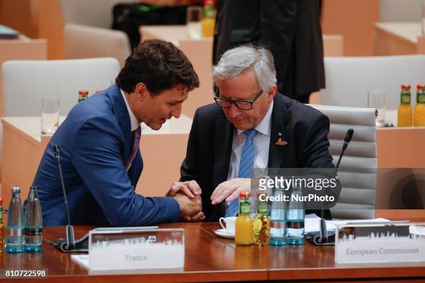 Prime Minister of Canada Justin Truedau and EC president Jean-Claude Juncker are seen at third plenary session at the G20 summit in Hamburg, Germany...