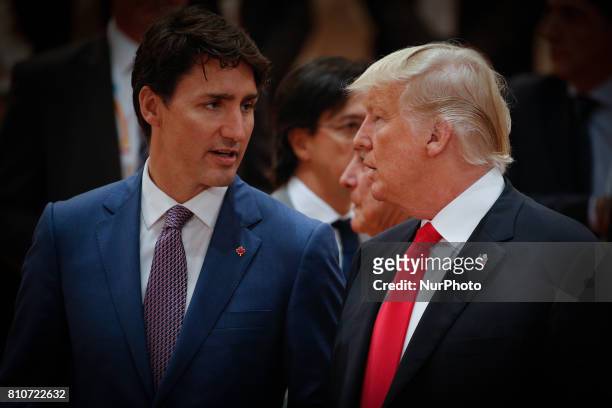 President Donald Trump is seen with Canadian PM Justin Trudeau ahead of the thrid plenary session of the G20 summit in Hamburg, Germany on 8 July,...