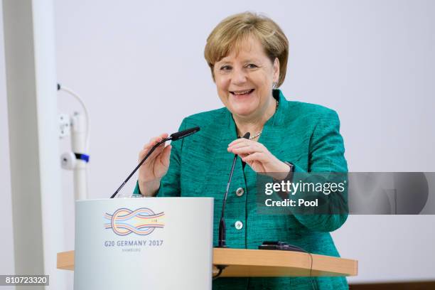 German Chancellor Angela Merkel attends a panel discussion titled 'Launch Event Women's Entrepreneur Finance Initiative' on the second day of the G20...