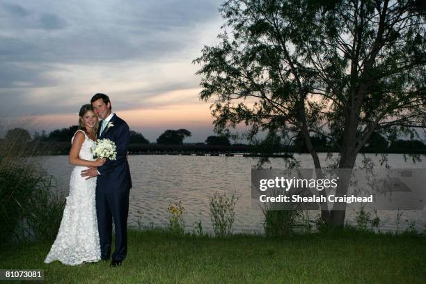 In this handout image provided by the White House, Henry and Jenna Hager pose for photographs along the lake at Prairie Chapel Ranch following their...