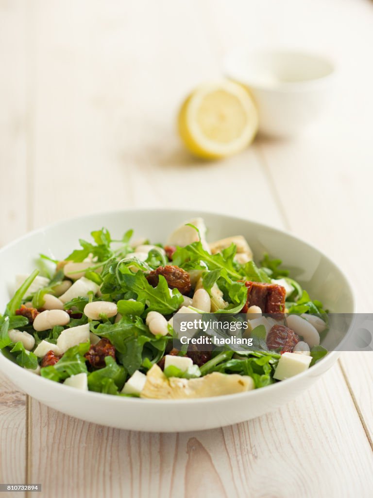 Cannelloni beans with artichokes rocket salad