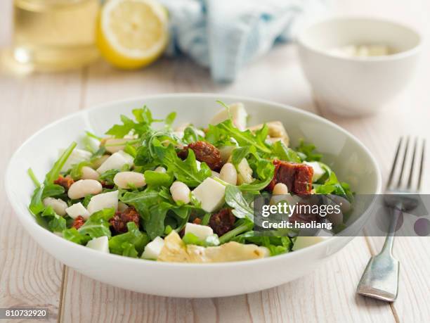cannelloni beans with artichokes rocket salad - cannelloni beans stock pictures, royalty-free photos & images