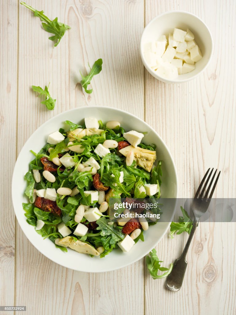 Cannelloni beans with artichokes rocket salad