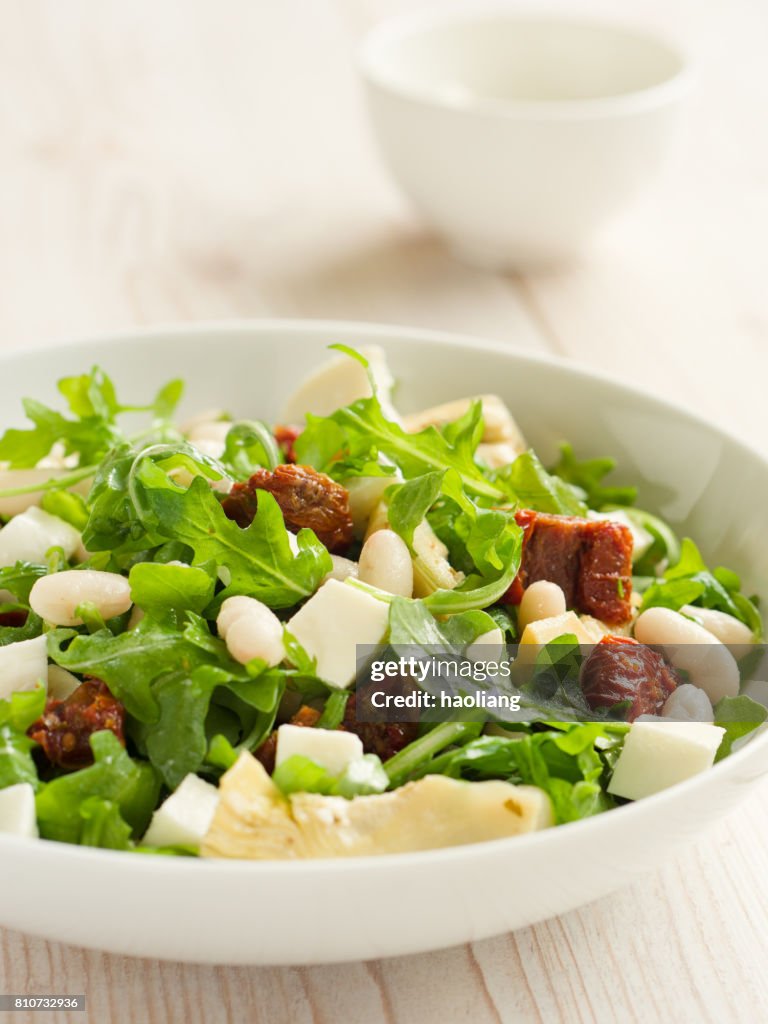 Cannelloni beans with artichokes rocket salad