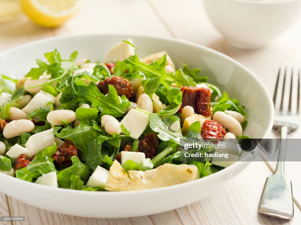 Cannelloni beans with artichokes rocket salad