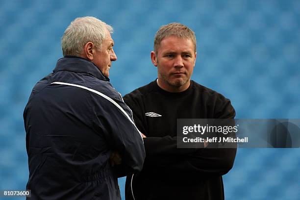 Walter Smith , Coach of Glasgow Rangers talks to Ally McCoist, assistant coach of Glasgow Rangers during the Glasgow Rangers training session ahead...