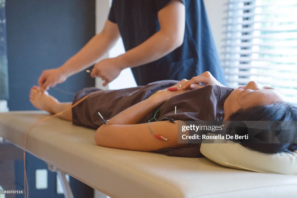 Patient receiving acupuncture treatment