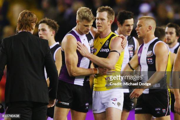 Nick Riewoldt of the Saints and Jack Riewoldt of the Tigers embrace after the round 16 AFL match between the St Kilda Saints and the Richmond Tigers...