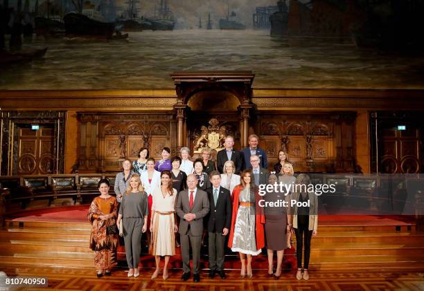 First Mayor of Hamburg Olaf Scholz poses with partners of Heads of State and Governments, plus respresentatives of guest invitees, during the partner...