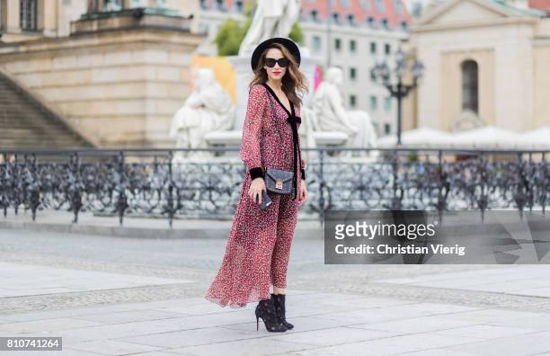 Alexandra Lapp wearing Boho Style, a red and cream floral print maxi dress from Philosophy di Lorenzo Serafini in sheer silk chiffon and bold black...