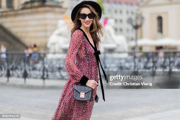 Alexandra Lapp wearing Boho Style, a red and cream floral print maxi dress from Philosophy di Lorenzo Serafini in sheer silk chiffon and bold black...