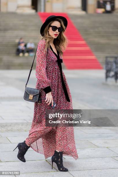 Alexandra Lapp wearing Boho Style, a red and cream floral print maxi dress from Philosophy di Lorenzo Serafini in sheer silk chiffon and bold black...
