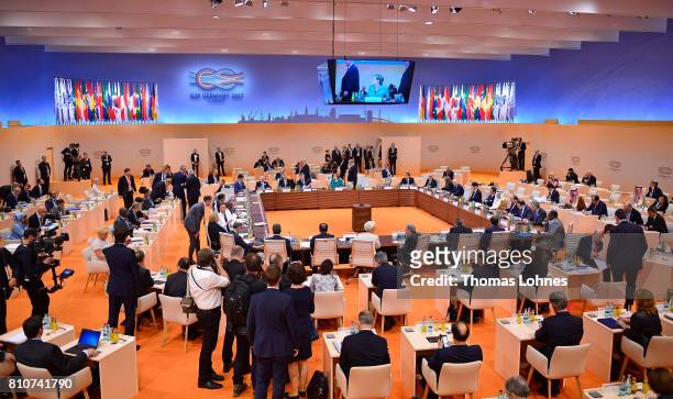 World leaders and delegates arrive to attend the morning working session on the second day of the G20 economic summit on July 8, 2017 in Hamburg,...