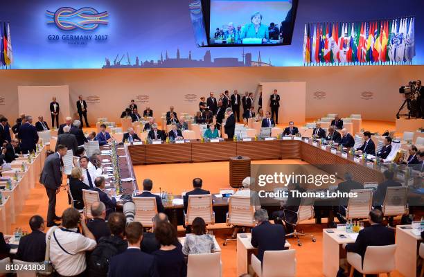 World leaders and delegates arrive to attend the morning working session on the second day of the G20 economic summit on July 8, 2017 in Hamburg,...