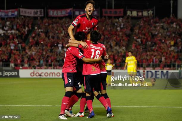 Kenyu Sugimoto of Cerezo Osaka joins the celebration as Souza of Cerezo Osaka scores his side's second goal during the J.League J1 match between...