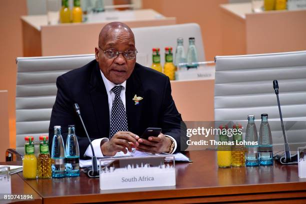 South African President Jacob Zuma arrives for the morning working session on the second day of the G20 economic summit on July 8, 2017 in Hamburg,...