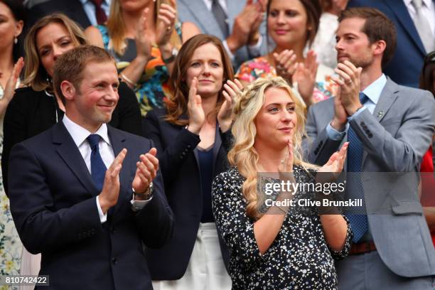 Jason and Laura Kenny applaud from the centre court royal box on day six of the Wimbledon Lawn Tennis Championships at the All England Lawn Tennis...