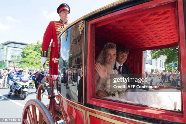 Carriage carrying Ekaterina of Hanover and Prince Ernst August of Hanover makes its way through Hanover after their church wedding ceremony in...