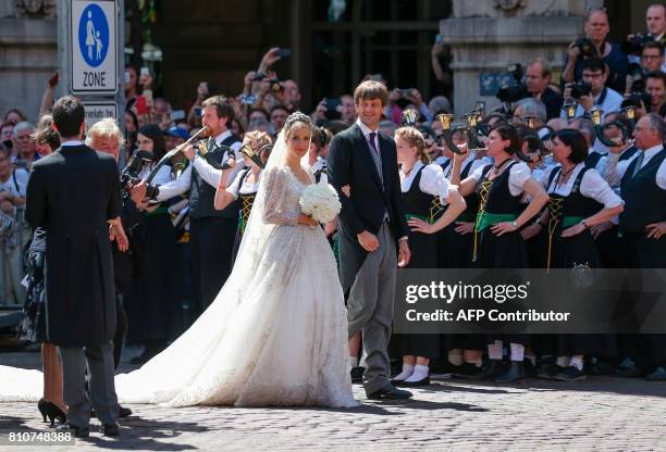 Ekaterina of Hanover and Prince Ernst August of Hanover leave after their church wedding ceremony in Hanover, central Germany, on July 8, 2017....