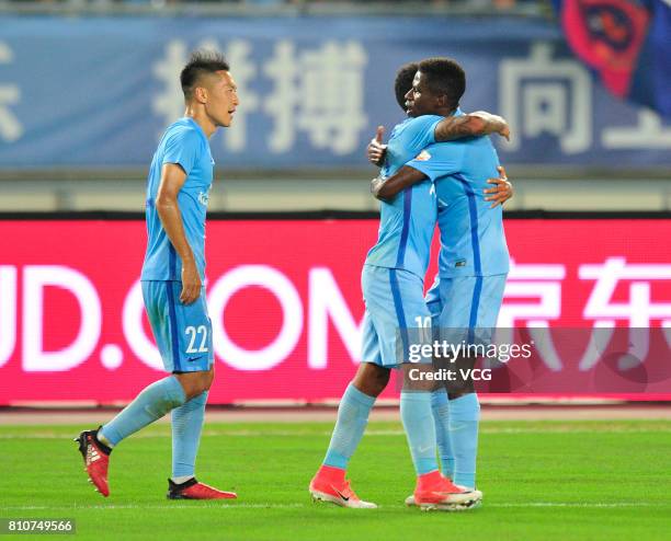 Ramires of Jiangsu Suning and Alex Teixeira of Jiangsu Suning celebrate a point during the 16th round match of 2017 Chinese Football Association...