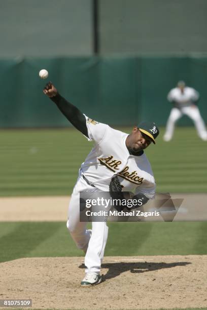 Santiago Casilla of the Oakland Athletics pitches during the game against the Kansas City Royals at the McAfee Coliseum in Oakland, California on...