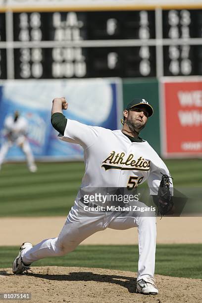 Andrew Brown of the Oakland Athletics pitches during the game against the Kansas City Royals at the McAfee Coliseum in Oakland, California on April...