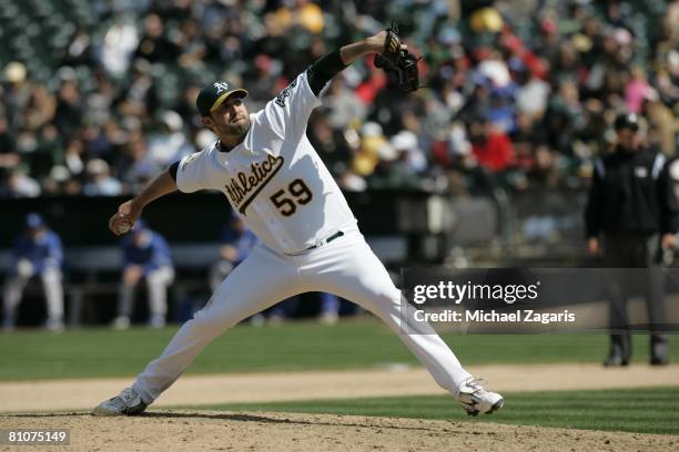 Andrew Brown of the Oakland Athletics pitches during the game against the Kansas City Royals at the McAfee Coliseum in Oakland, California on April...