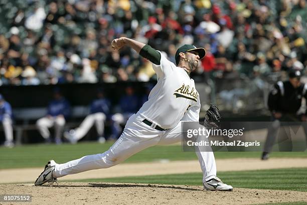 Andrew Brown of the Oakland Athletics pitches during the game against the Kansas City Royals at the McAfee Coliseum in Oakland, California on April...