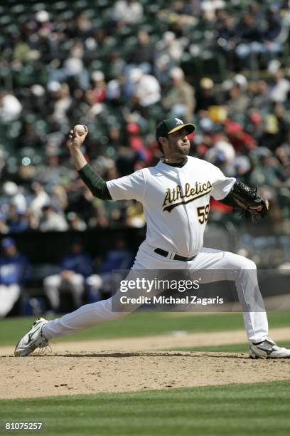 Andrew Brown of the Oakland Athletics pitches during the game against the Kansas City Royals at the McAfee Coliseum in Oakland, California on April...