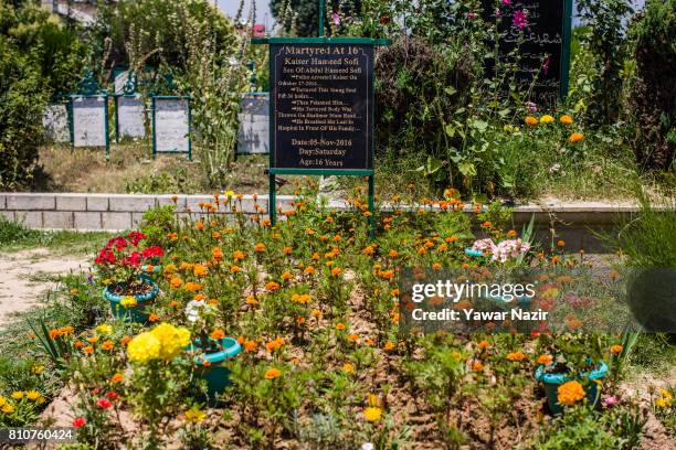 Headstone on the grave of a Kashmiri Muslims teenager who was killed last year, on the the first death anniversary of Burhan Wani a young rebel...