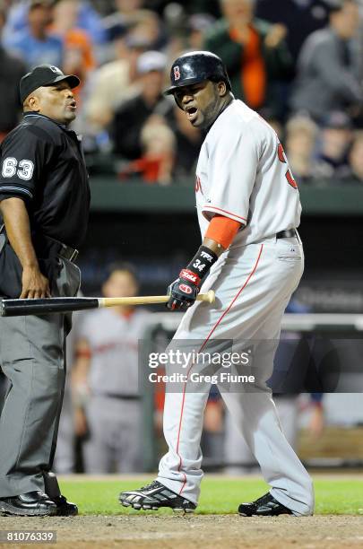 David Ortiz of the Boston Red Sox argues with home plate umpire Laz Diaz after being called out on strikes in the ninth inning against the Baltimore...