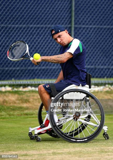 Andy Lapthorne of Great Britain plays a backhand during his Quad Singles Final match against David Wagner of the USA during day three of the Surbiton...