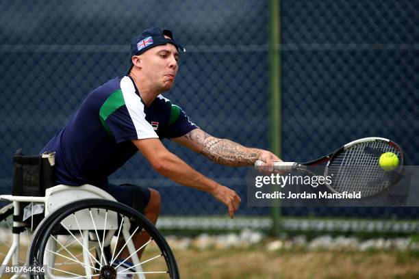 Andy Lapthorne of Great Britain plays a forehand during his Quad Singles Final match against David Wagner of the USA during day three of the Surbiton...