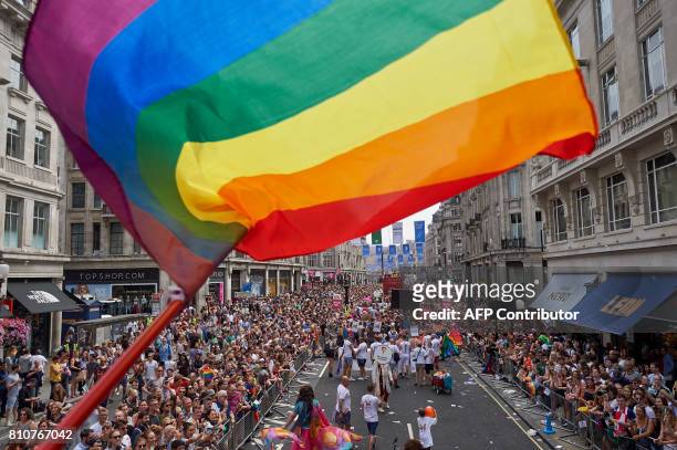 Members of the Lesbian, Gay, Bisexual and Transgender community take part in the annual Pride Parade in London on July 8, 2017.