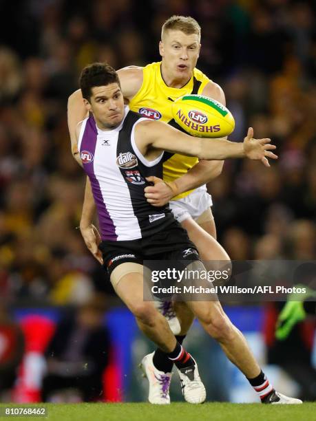 Leigh Montagna of the Saints and Josh Caddy of the Tigers compete for the ball during the 2017 AFL round 16 match between the St Kilda Saints and the...