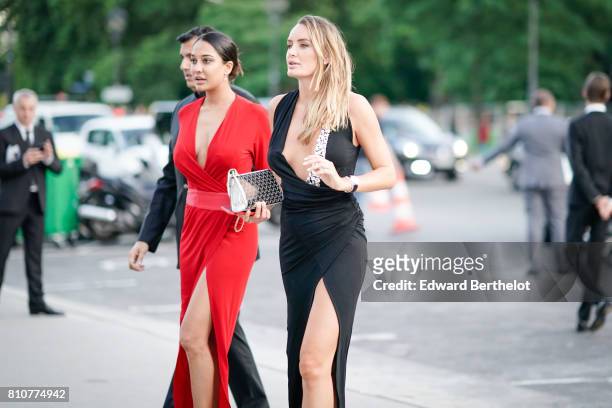 Guest wears a red dress ; a guest wears a black dress outside the amfAR dinner at Petit Palais, during Paris Fashion Week - Haute Couture Fall/Winter...