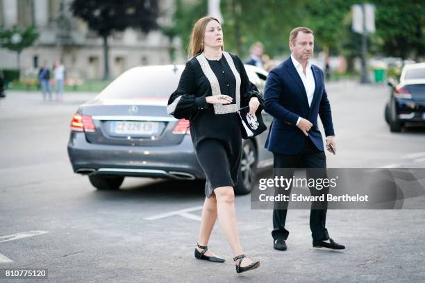 Guest wears a black top and a black skirt , outside the amfAR dinner at Petit Palais, during Paris Fashion Week - Haute Couture Fall/Winter...