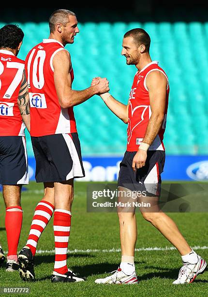 Peter Everitt of the Swans greets team mate Nick Malceski during a Sydney Swans AFL training session at the Sydney Cricket Ground on May 14, 2008 in...